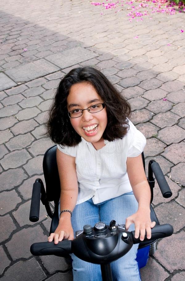 Hispanic girl on scooter